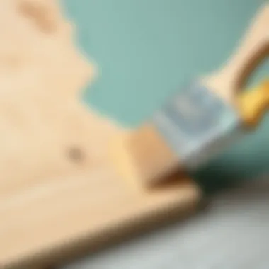 Applying Paint to Particle Board A brush applying paint smoothly on a particle board